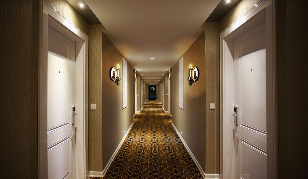 Long and dark hotel corridor. Indoor architectural Feature.