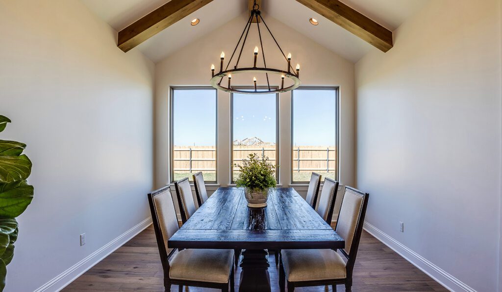 Wood beams on vaulted ceiling with lovely chandelier