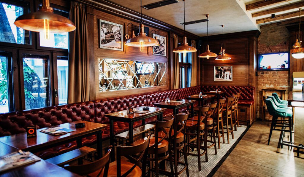 Inside of modern empty pub, no people.